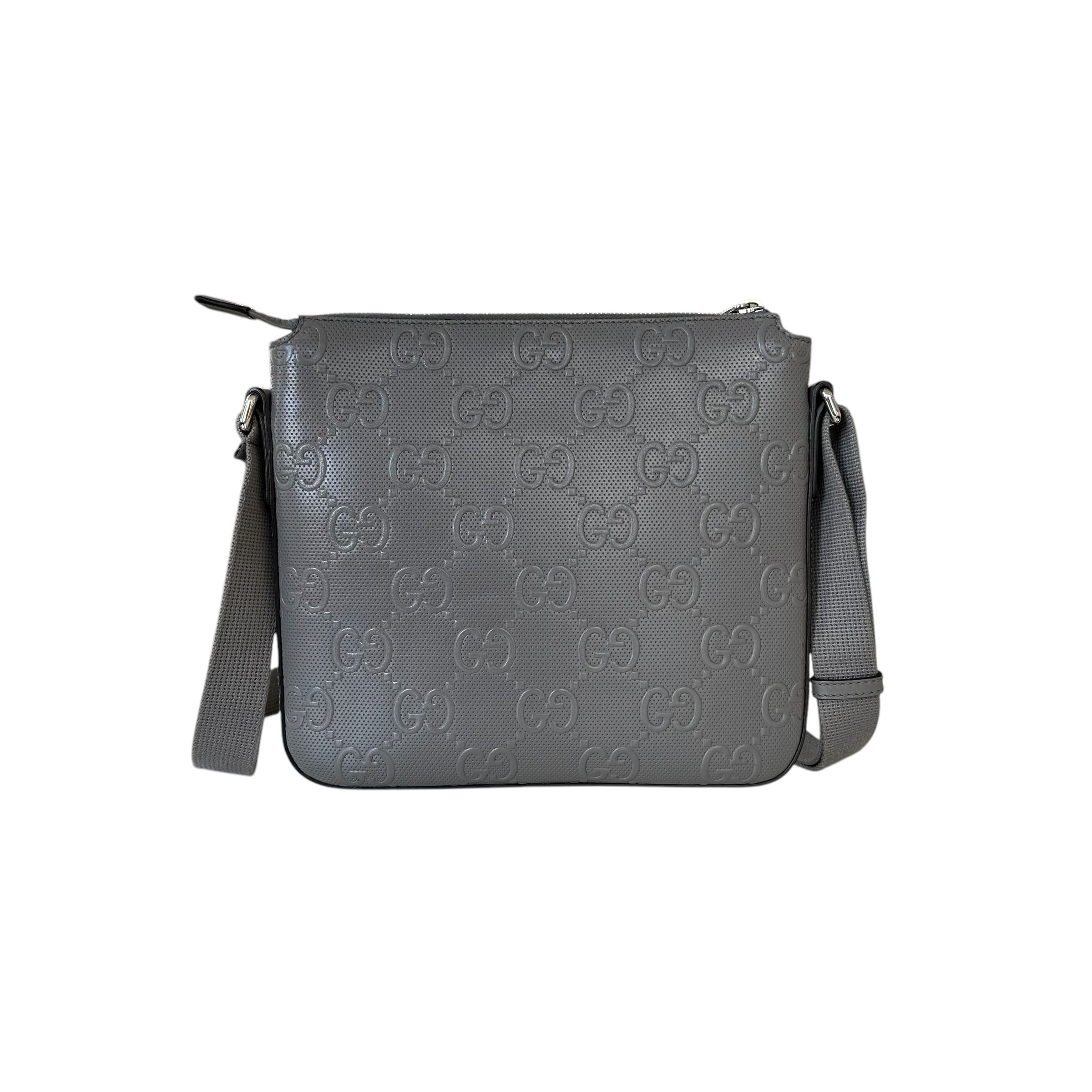 Gucci Messenger in pelle traforata con GG