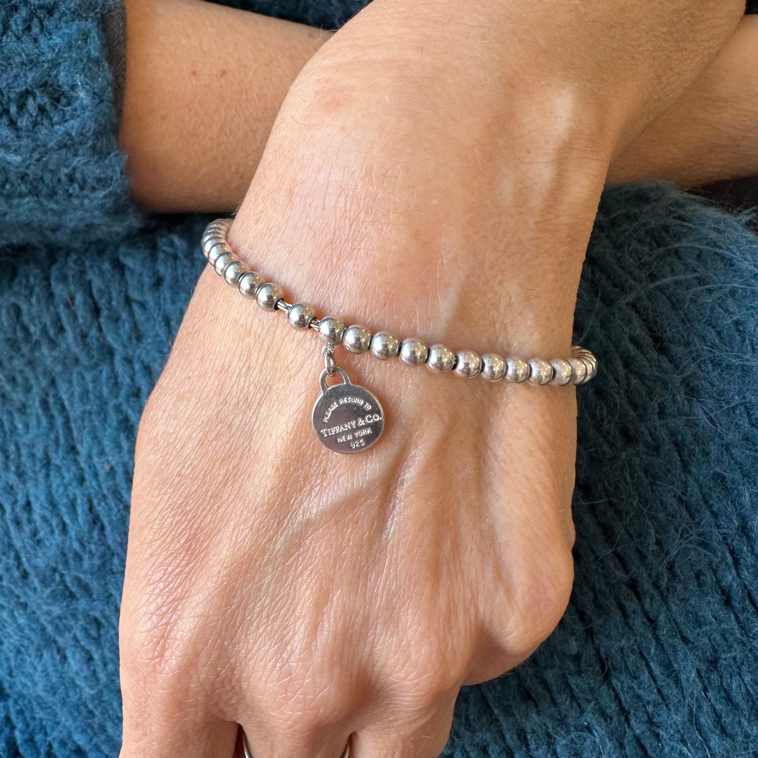Tiffany & Co bracciale Bead con ciondolo mini round tag